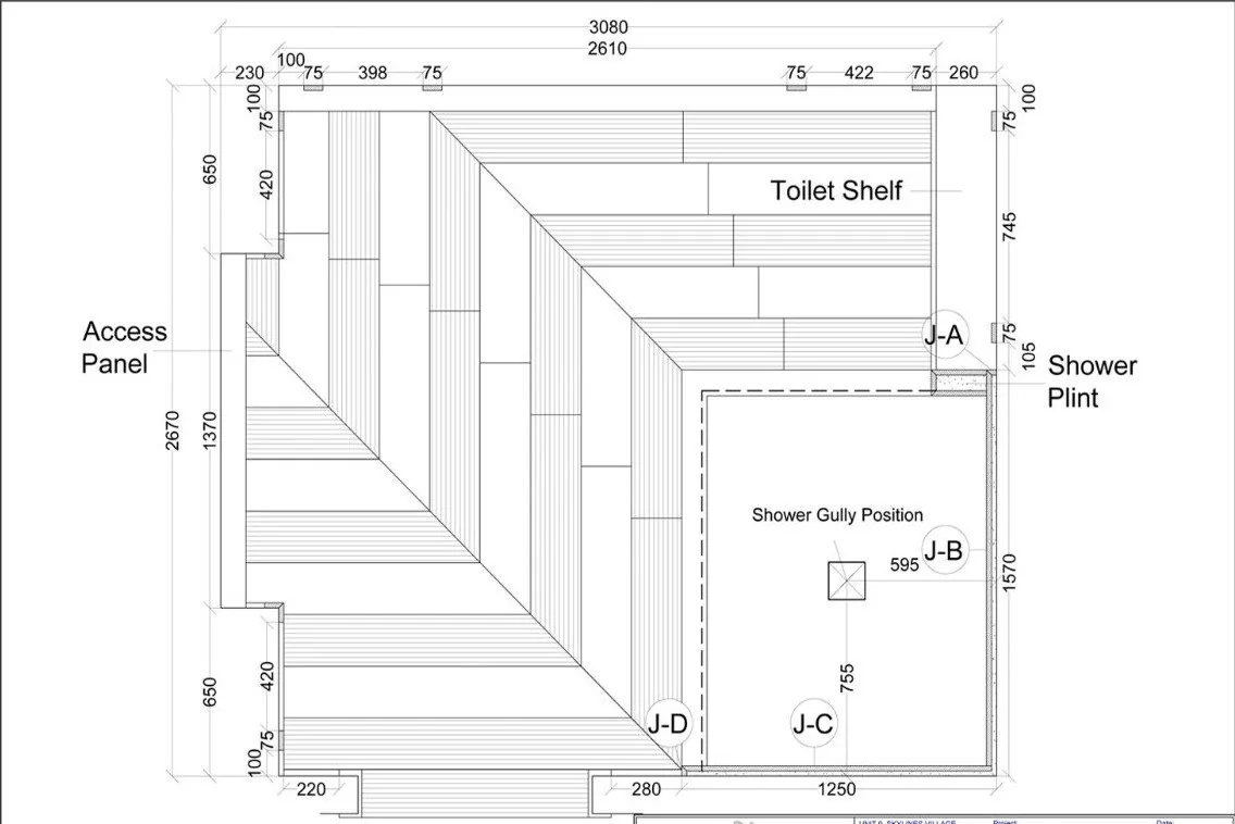 Bathroom floor plan with a diagonal stone tile pattern and shower area